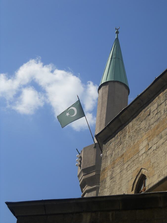 Minaret and crescent flag